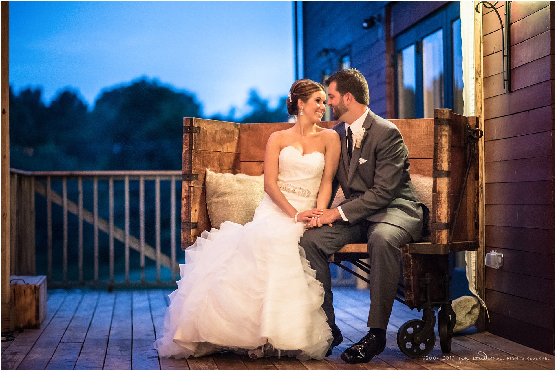 barn at gibbet hill bride and groom sitting at night