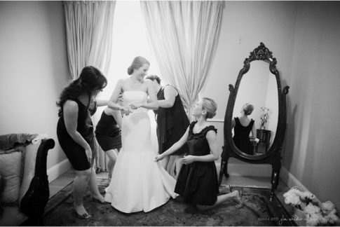 bride and bridesmaids getting ready black and white