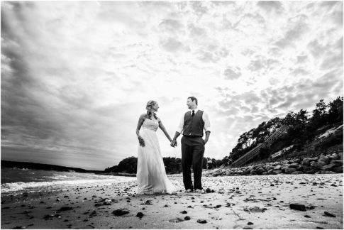 dramatic beach portrait of bride and groom