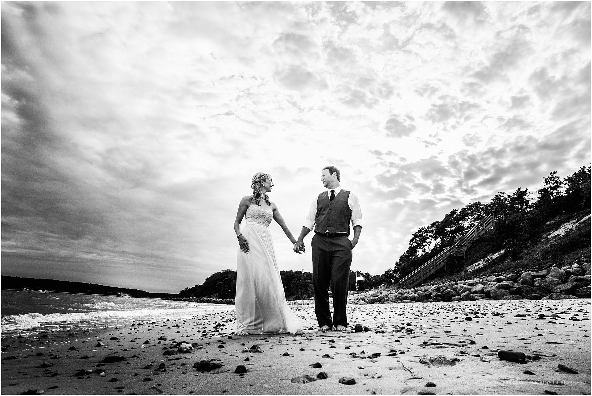 dramatic beach portrait of bride and groom