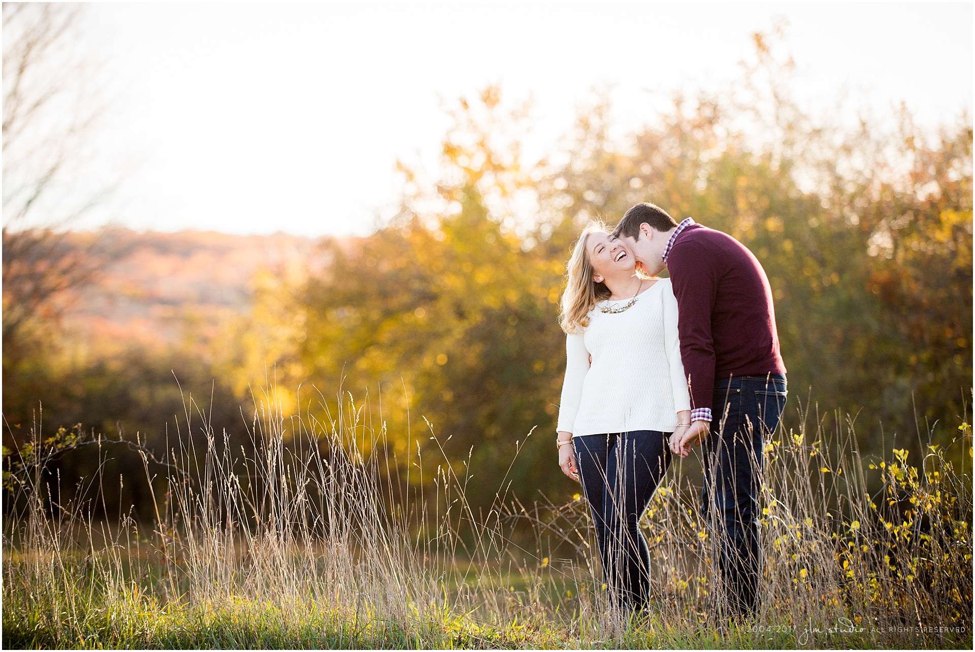 fall sunset engagement photo cream and burgundy sweaters