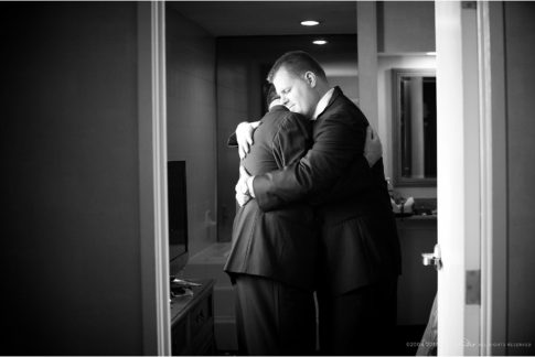 grooms hug before ceremony same-sex wedding moment