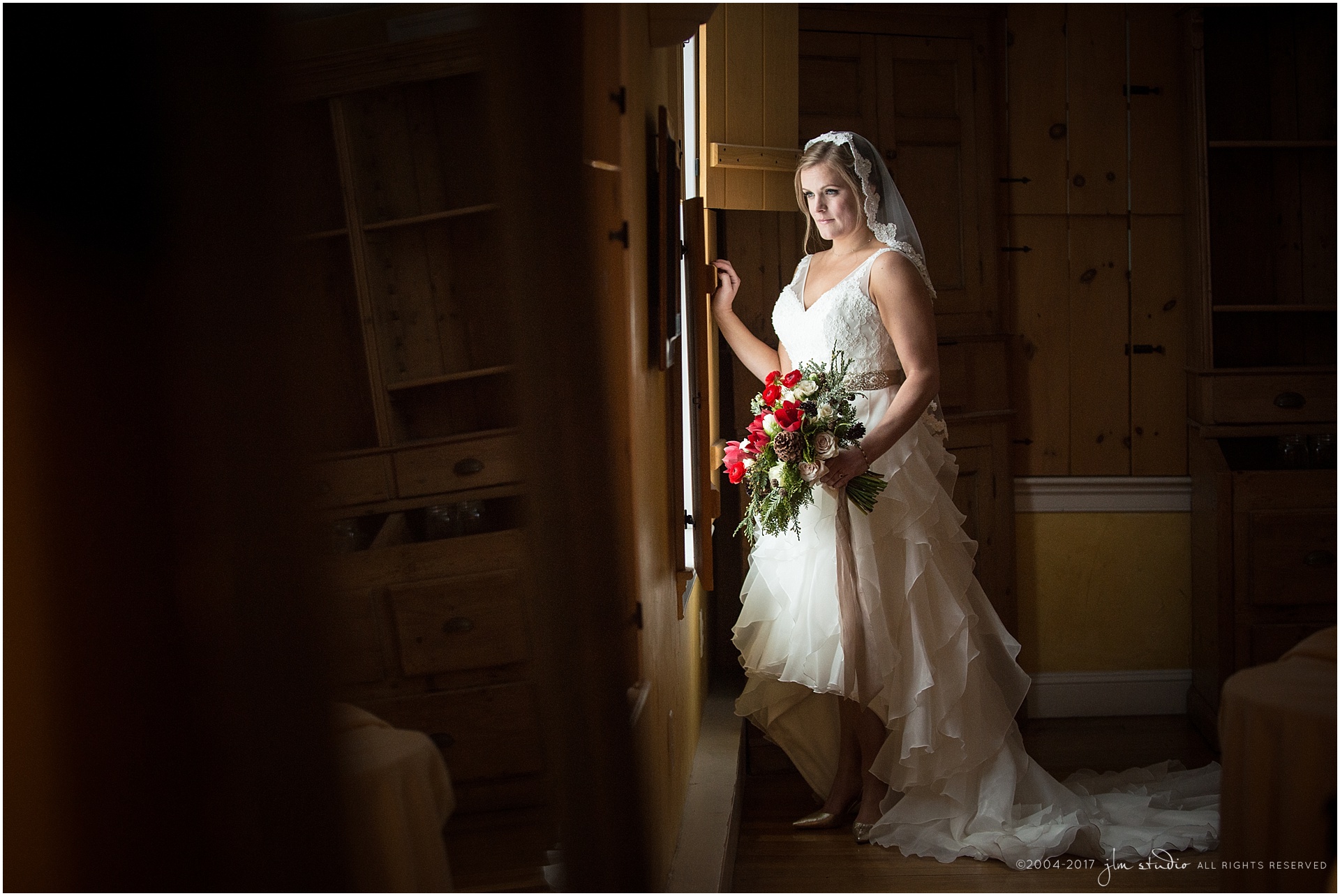 red lion inn bride winter wedding red flowers