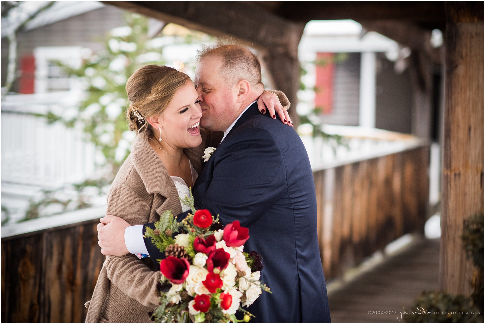red lion inn winter wedding bride and groom red flowers