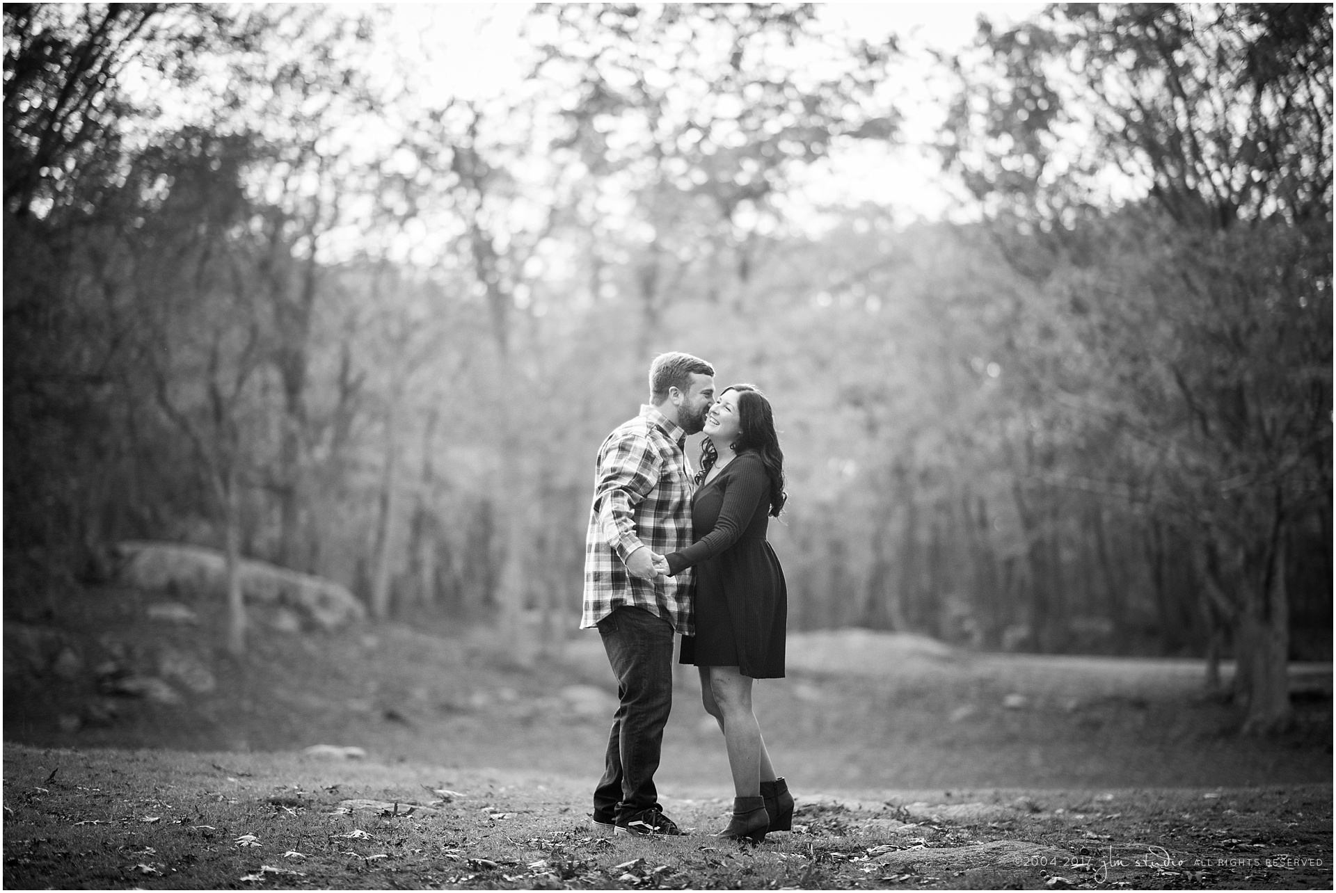 rhode island engagement groom kissing bride on cheek