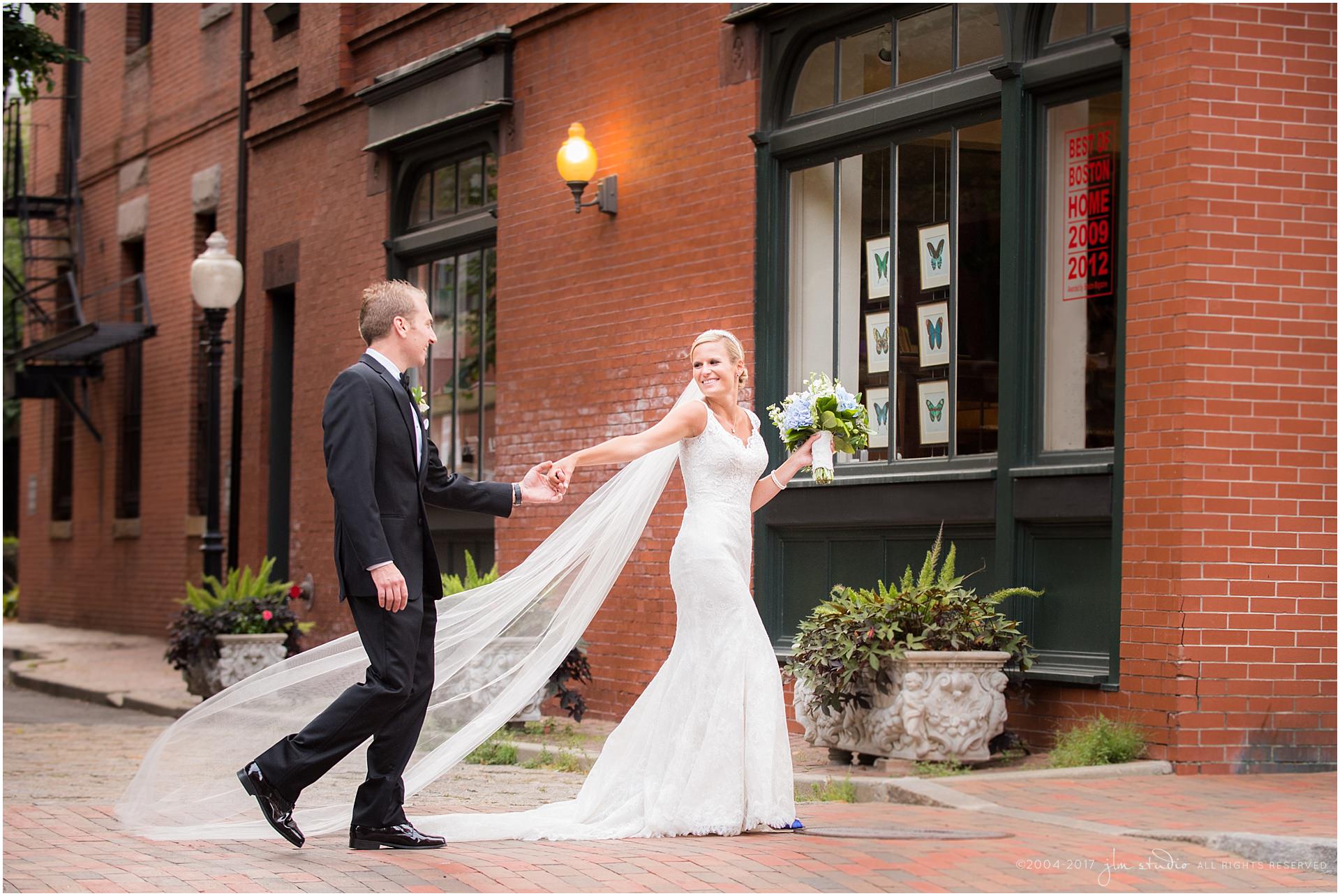bride and groom walking in the city