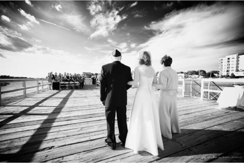 new england photojournalistic wedding photographer black and white ceremony on a dock
