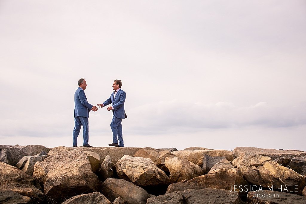 Two grooms walking on provincetown causeway